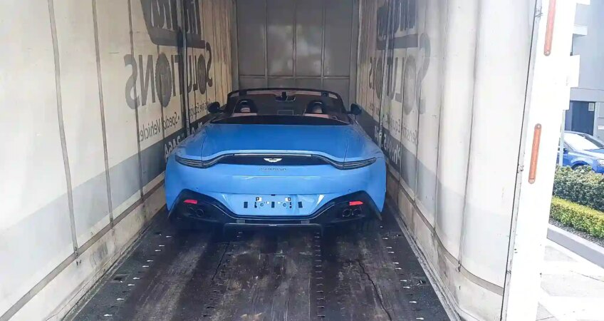 An Aston Martin being transported