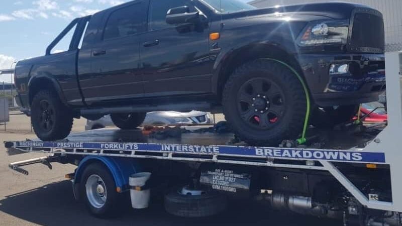 A RAM Ute being towed interstate