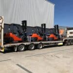 Forklifts being transported