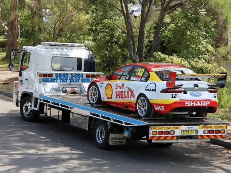 Race car towed at back of truck