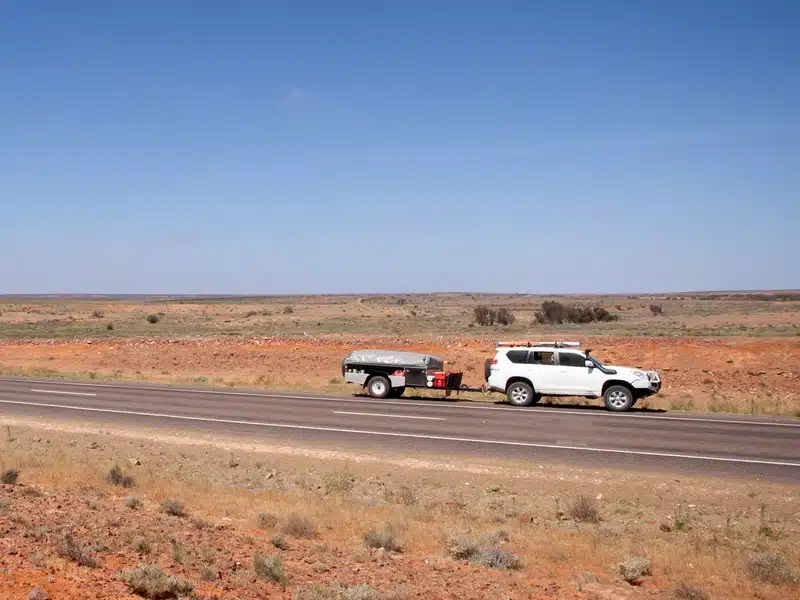 a suv towing a small trailer in outback NSW