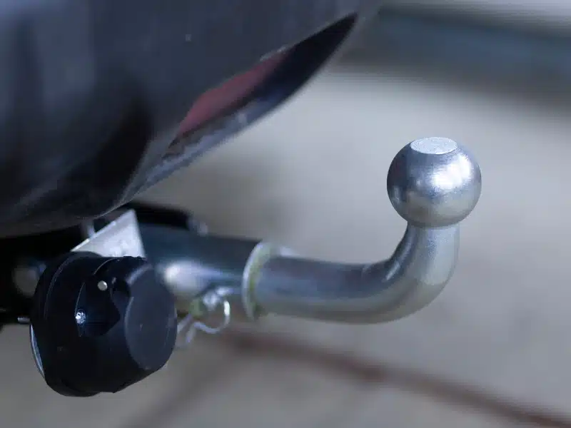 a close up image of a tow bar and electrical socket on a vehicle that can tow