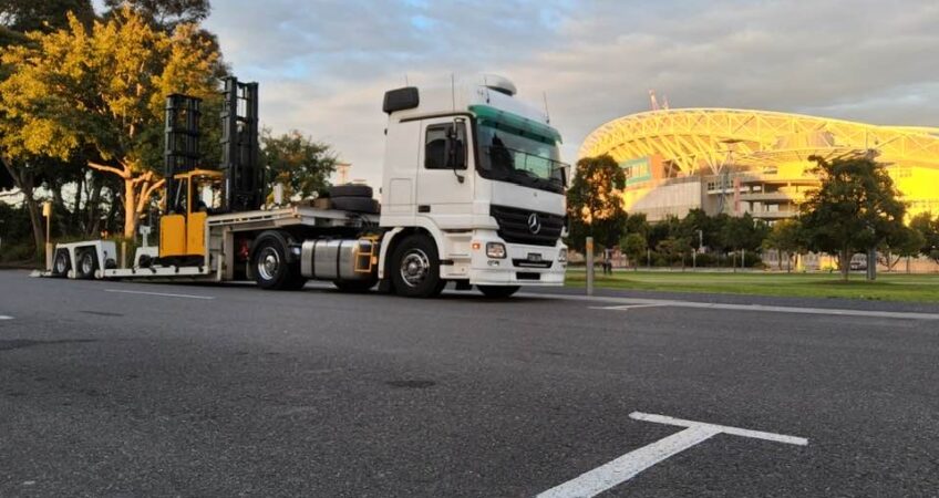 A tow truck outside of a stadium