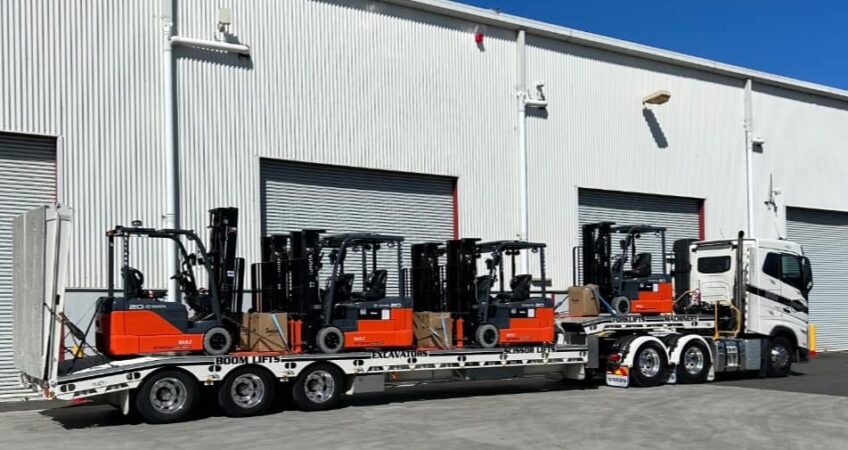 Forklifts being transported