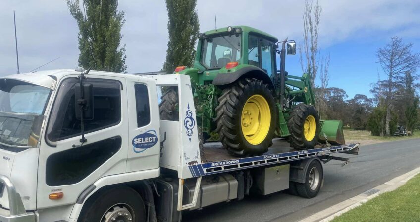 Farming tractor being towed