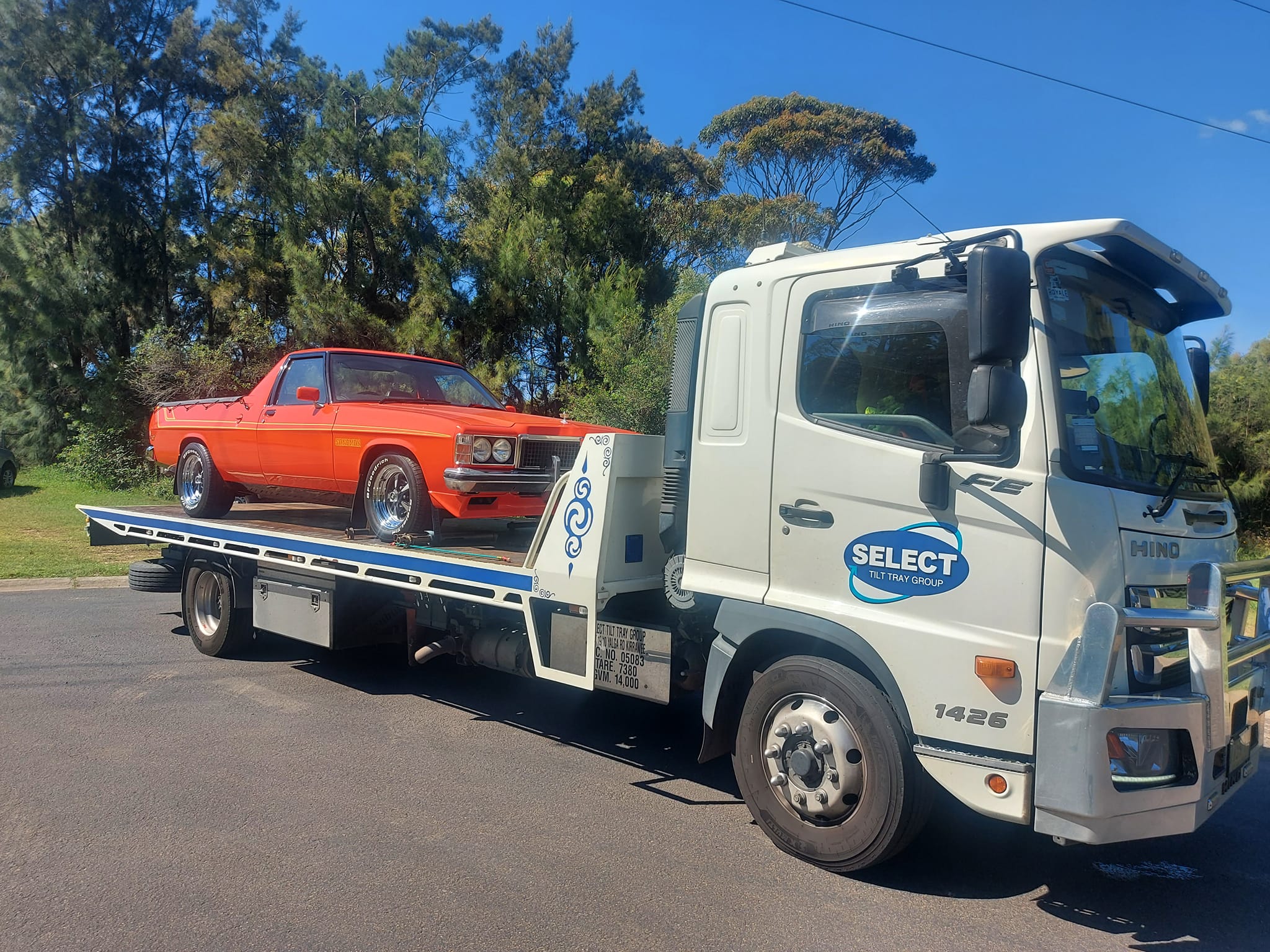 Prestige vehicle secured on a tow truck.