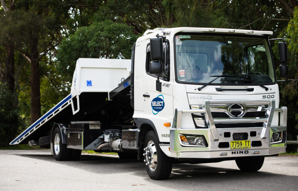 STTG tow truck on the road.